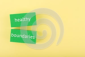 Mental health and healthy boundaries concept on yellow background with copy space photo