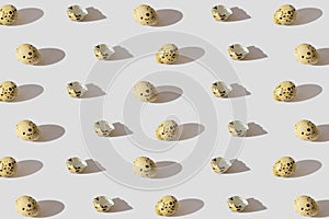 Minimal style pattern made of quail eggs. Easter creative concept