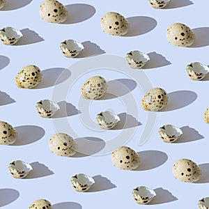 Minimal style pattern made of quail eggs on pastel background with shadow. Easter creative concept