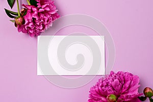 Minimal Styled Flat lay with Pink Peony flowers and white blank Mock up top view Horizontal