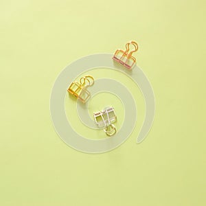 Minimal work space - Creative flat lay photo of workspace desk with paperclips on copy space pastel background. Top view
