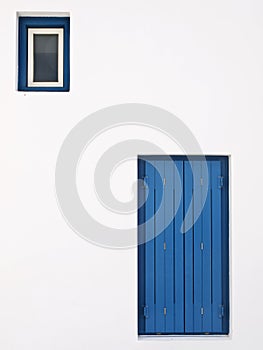 Minimalist architectural photo of a door and a window.
