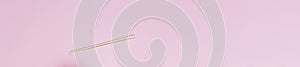 Minimalism chopsticks flatlay on pink background long banner flatlay