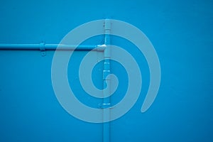 Minimalism style, Blue water tube on the wall.