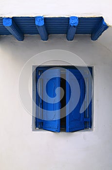 Minimalist blue window on whitewash