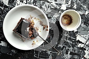 Minimalist breakfast with coffee and chocolate cake