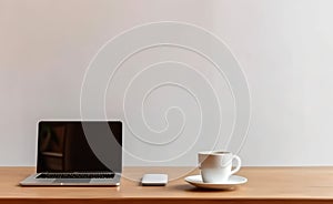 Minimalist caf?? table with blank white screen laptop and mobile