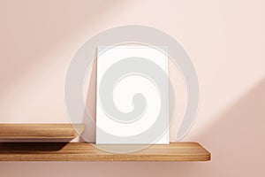 Minimalist and clean vertical white poster or photo frame mockup on the wooden table leaning against the room wall