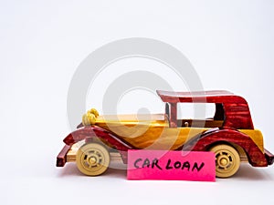 A minimalist close up shot of one vintage car toy against white background for loan concept