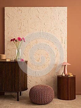 Minimalist composition of living room interior with mock up poster frame, wooden sideboard, stand, vase with pink flowers, lamp,