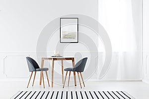 Minimalist dining room with poster