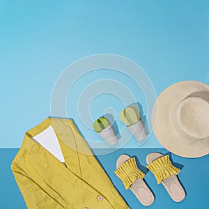 Minimalist female casual outfit with straw hat and linen jacket.