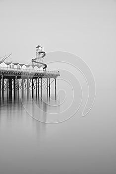 Minimalist fine art landscape image of new pier in juxtaposition