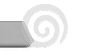 Minimalist gray rectangular object placed on a plain surface
