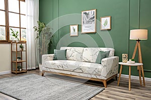 Minimalist green wall with modern sofa and marble patterns