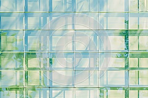 Minimalist grid patterns in light blue and green, representing structure and order