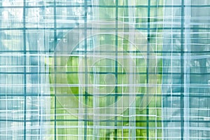 Minimalist grid patterns in light blue and green, representing structure and order