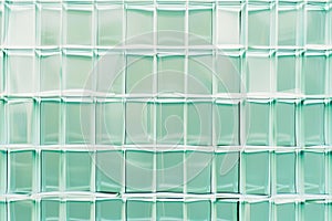 Minimalist grid patterns in light blue and green, representing structure and order