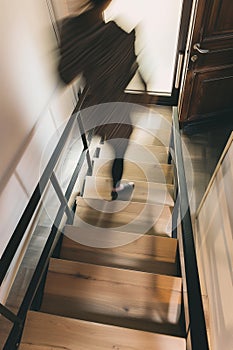 minimalist interior design, white walls with wooden beams on the ceiling, wood staircase, light brown stairs handrail