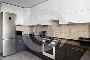 Minimalist kitchen interior with built-in electronics photo