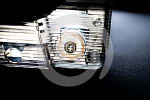 Minimalist Macro Closeup of Pinch Roller in Corner of Clear Cassette Tape