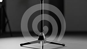 Minimalist Microphone Stand in Black and White Studio Setting