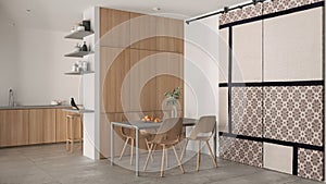 Minimalist modern wooden dining room and kitchen in white tones, concrete tiles, table with chairs, wooden cabinets and shelves,