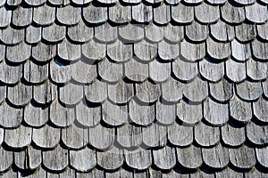 Minimalist monochome background of old wooden pieces on a house roof photo