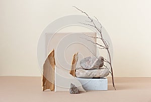 Minimalist monochrome still life composition with  natural nature materials: stone, marble, earthy clay and plant dry branch