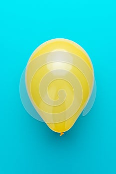 Minimalist photo of balloon on the turquoise blue background