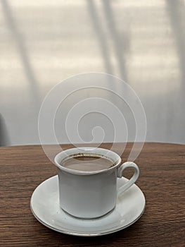 A minimalist photo of a cup of coffee photo