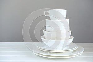 Minimalist picture of white porcelain kitchenware piled up