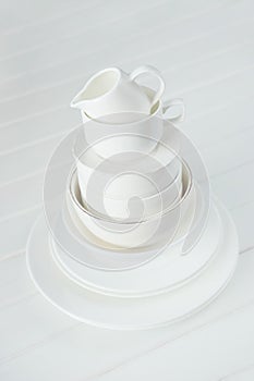 Minimalist picture of white porcelain kitchenware piled up