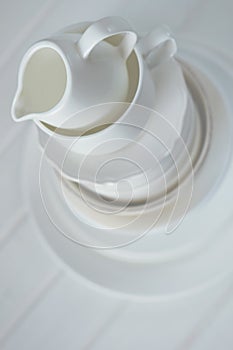 Minimalist picture of white porcelain kitchenware piled up