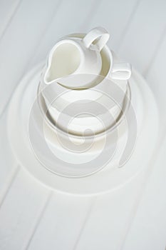 Minimalist picture of white porcelain kitchenware piled up