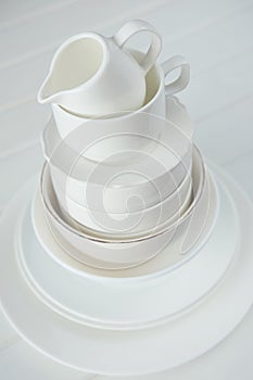 Minimalist picture of white porcelain kitchenware piled up