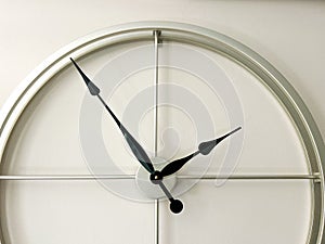 Minimalist Silver Wall Clock With Black Hands, Indoor Studio Setting, Perfect For Modern Interior Design, Time Management photo