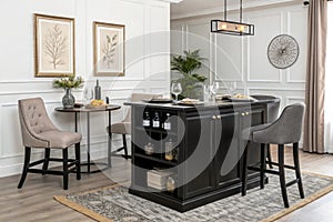 Minimalist small dining space with black kitchen island