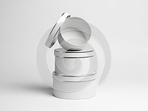 Minimalist stack of white cylindrical containers isolated on white background