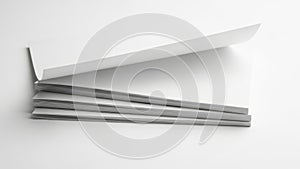 Minimalist stack of white and gray paper sheets