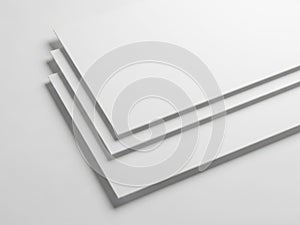 Minimalist stack of white paper sheets on a clean surface