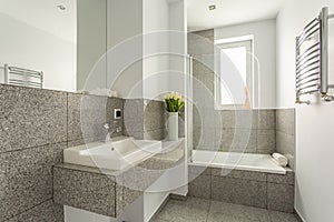 Minimalist washbasin in granite bathroom