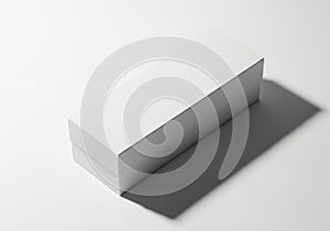 Minimalist white rectangular box casting a long shadow