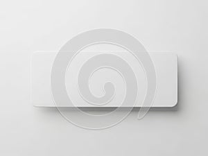Minimalist white rectangular object with a curved edge on a plain background