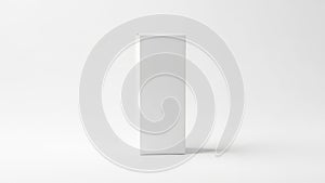 Minimalist white rectangular object standing on a plain surface