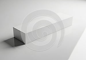 A minimalist white rectangular prism casting a shadow on a white background isolated on white background