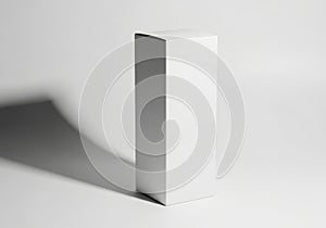 Minimalist white rectangular prism with dramatic shadow
