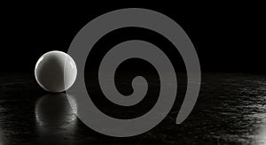 Minimalist white sphere reflecting on black floor