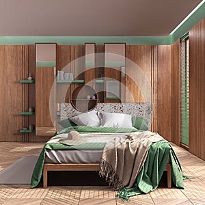Minimalist wooden bedroom in green and beige tones, close up. Master bed with blankets, parquet and window with venetian blinds.