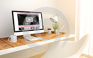 Minimalist workplace with video streaming computer